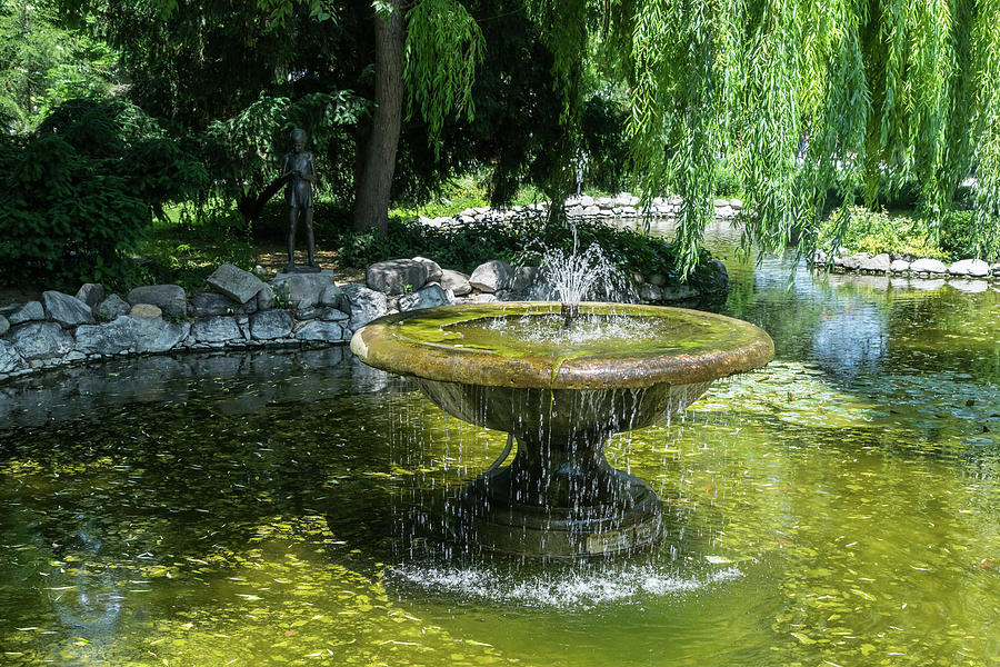 Refreshing Summer - the Little Fisherman Fountain Cheerfully Splashing in the Sunshine Photograph by Georgia Mizuleva