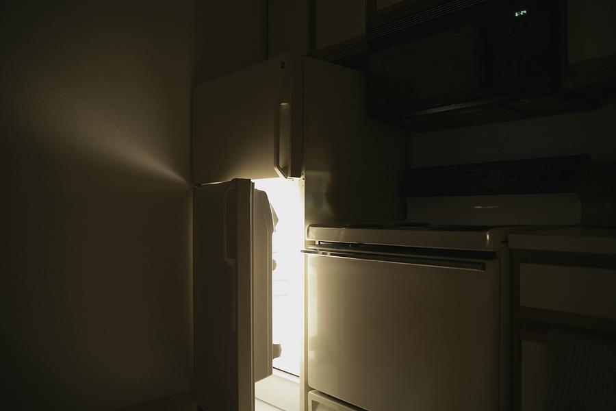 Refrigerator door open at night Photograph by Frederick Bass