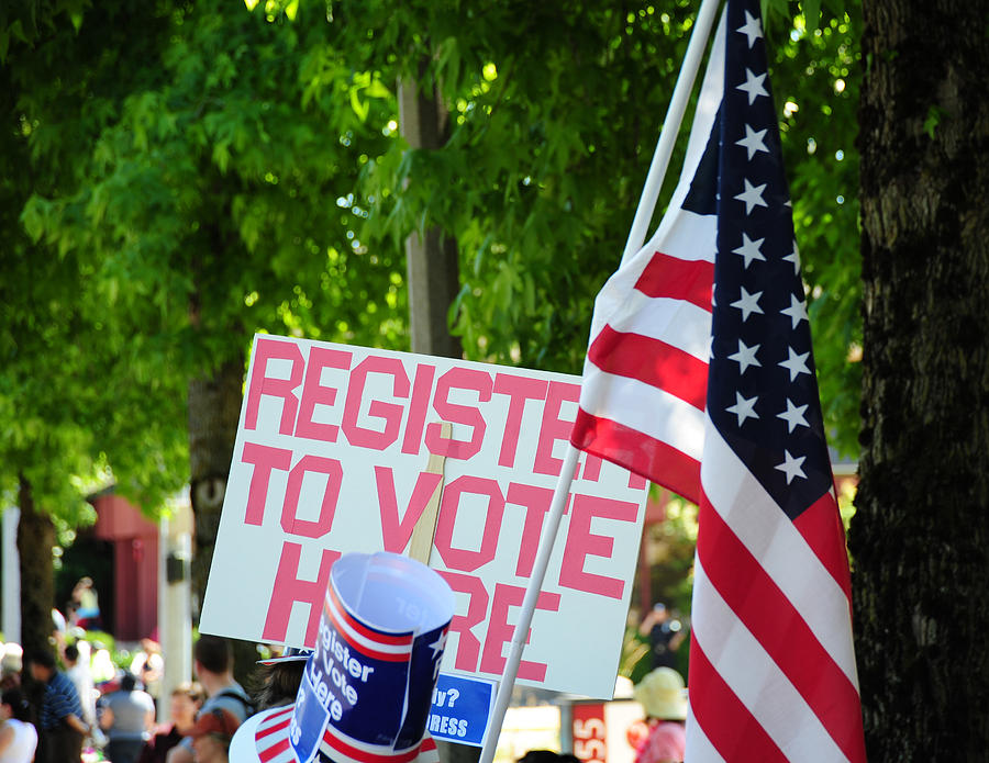 Register to vote sign. Photograph by Oscar Williams - Fine Art America