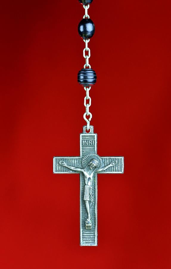 Religious Rosary praying beads on a red background Photograph by Douglas Sacha