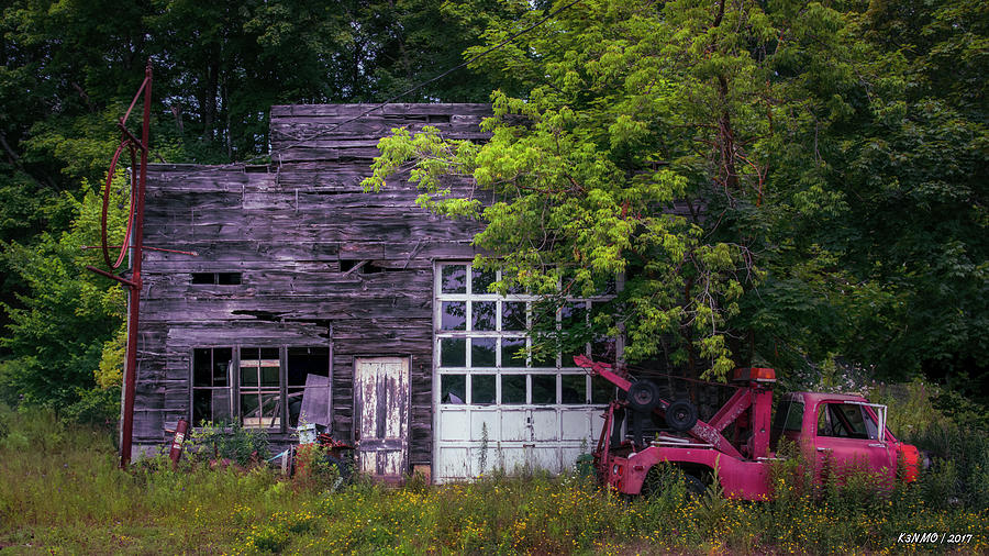 Architecture Photograph - Remains of an Old Tow Truck and Garage by Ken Morris