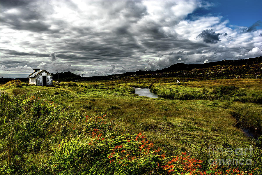 Remote Hut Beneath River in Ireland Photograph by Andreas Berthold