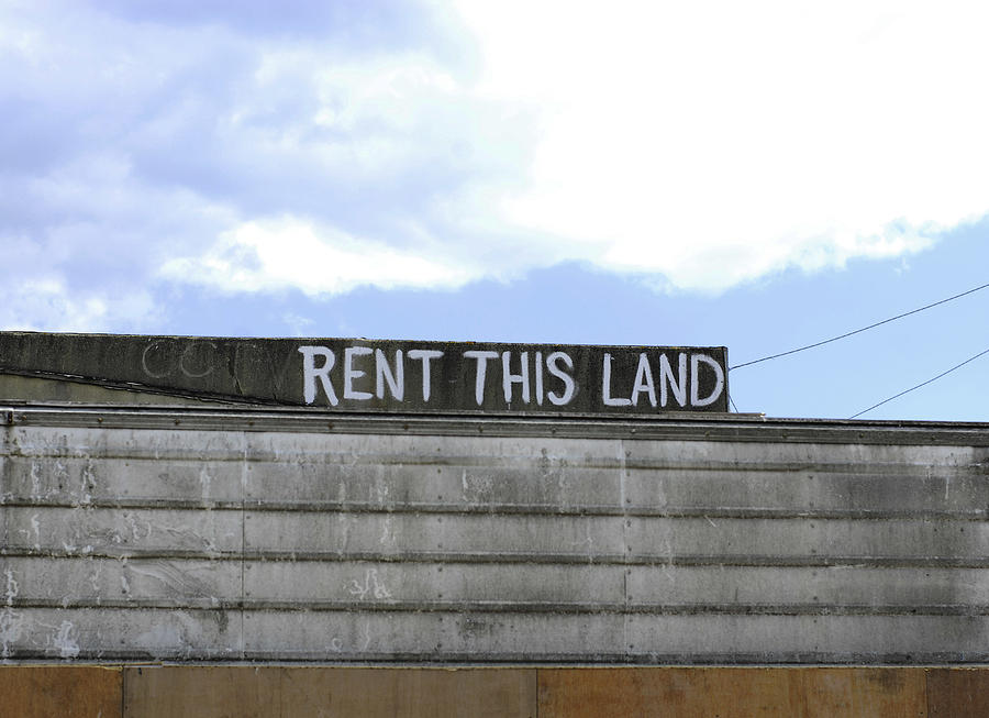 Rent This Land sign against blue sky Photograph by Lyn Holly Coorg