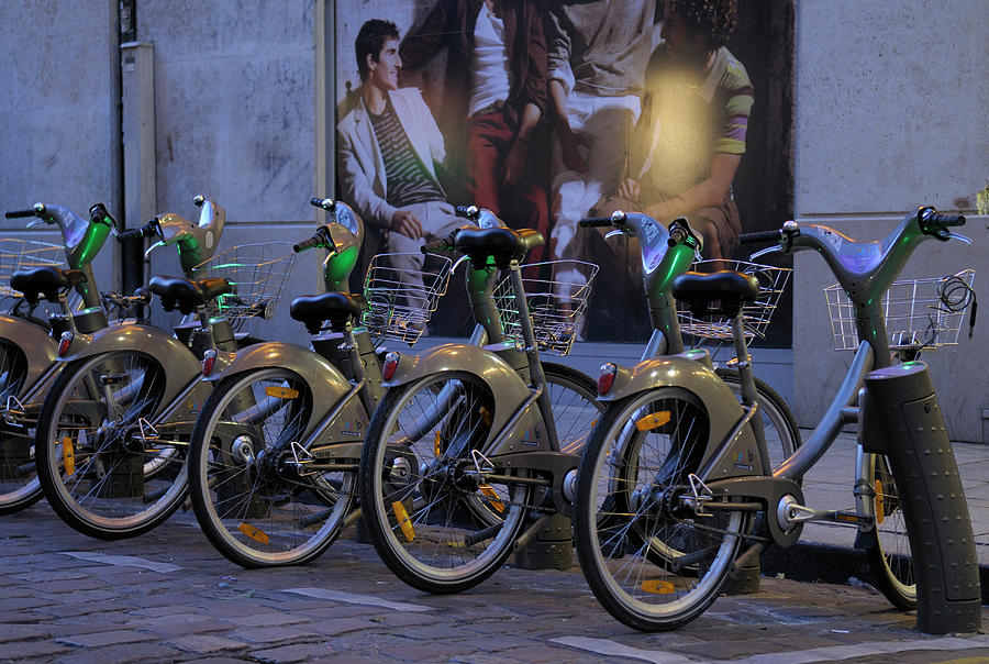 Rental bicycles on a Paris street, Paris,Ile-de-France, France Photograph by Kevin Oke