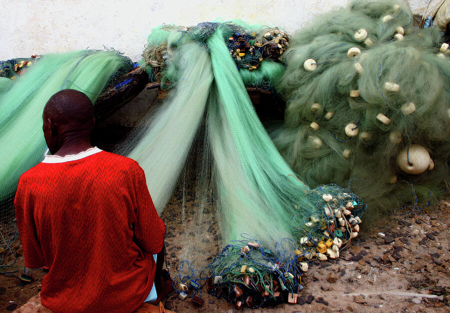 Repairing the Nets in Cape Coast Photograph by Wayne King