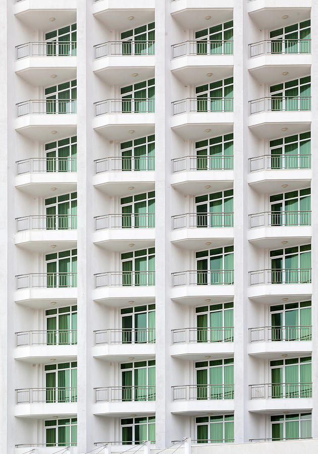 repeating pattern of windows and balcony. Bulding front Photograph