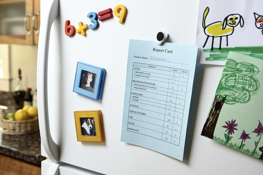 Report Card on Refrigerator Photograph by Jeffrey Coolidge