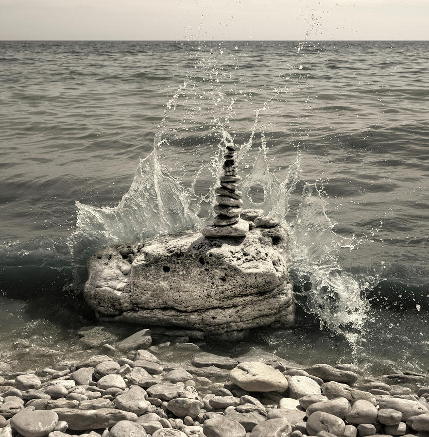 Resist - a cairn upon rock resisting waves of Lake Michigan at Door County Photograph by Peter Herman