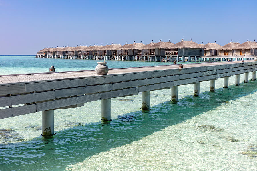 Resort in Maldives. Water villas along wooden jetty Photograph by Michal Bednarek