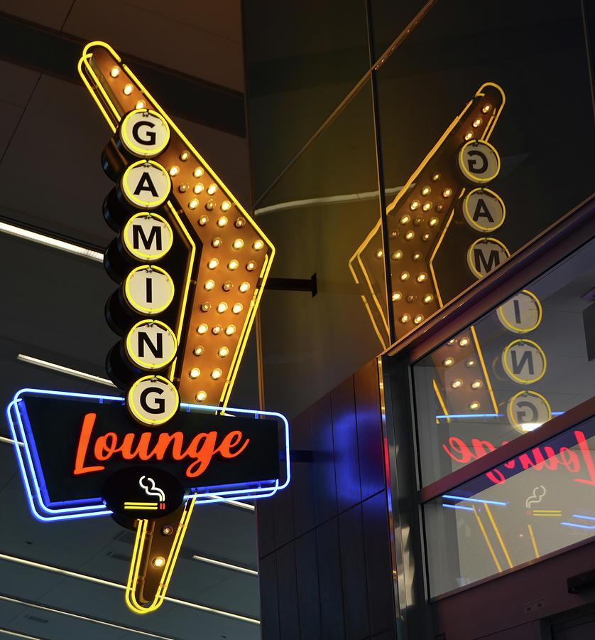 Retro Flying V Neon Gaming Lounge Sign and Reflection McCarran Airport Las Vegas Photograph by Shawn OBrien