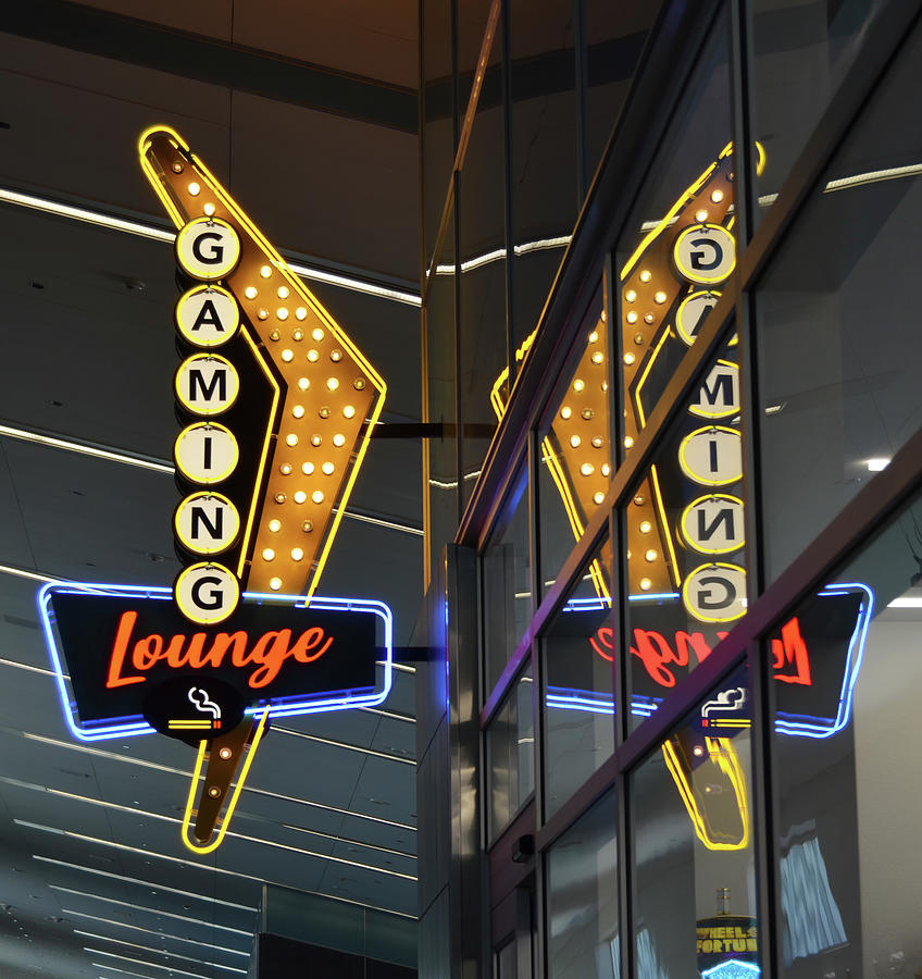 Retro Flying V Neon Gaming Lounge Sign and Reflection McCarran International Airport Las Vegas Photograph by Shawn OBrien