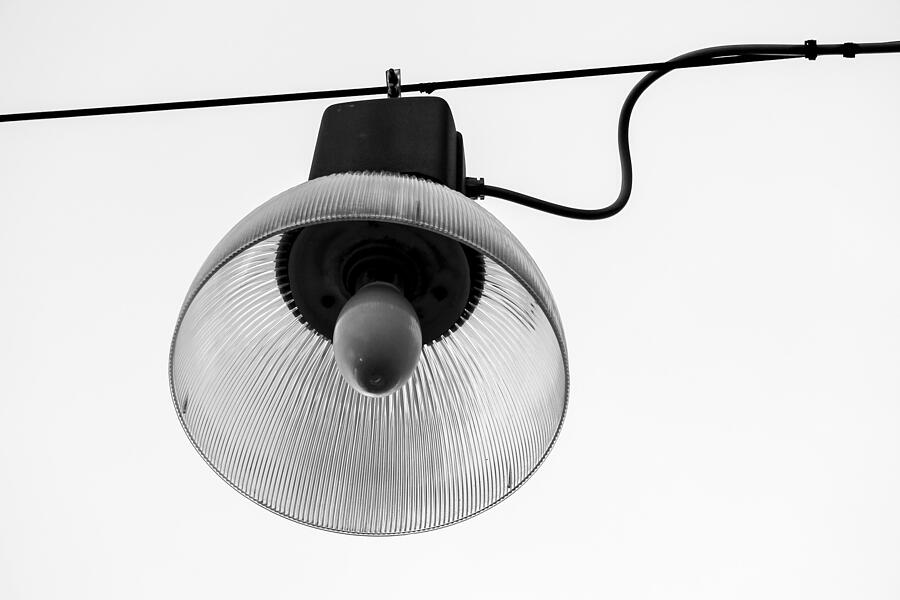 Retro hanging street lamp. Isolated on white. Black and white Photograph by Agawa288