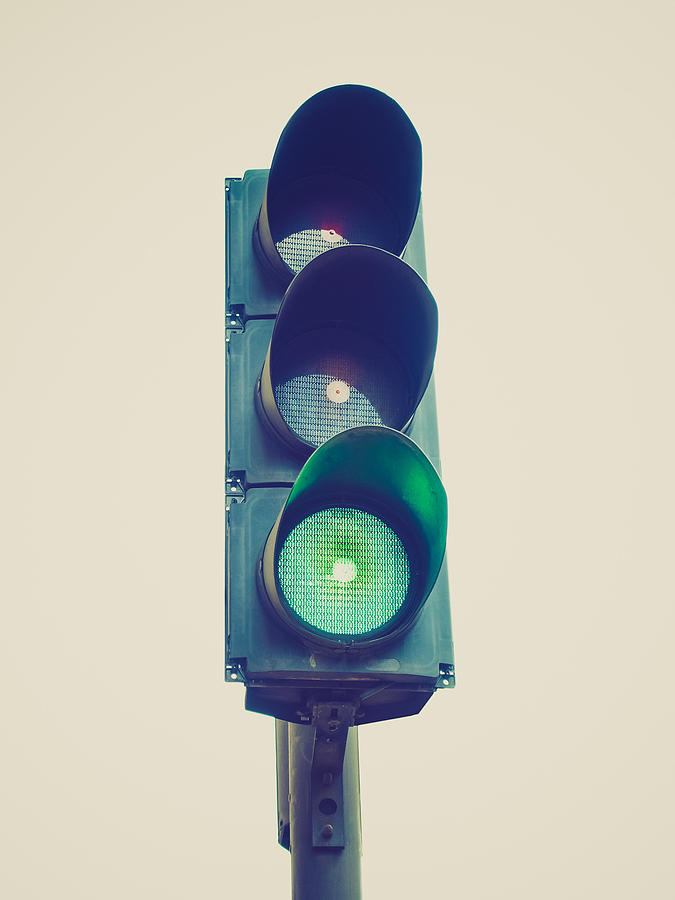 Retro look Traffic light semaphore Photograph by Claudiodivizia