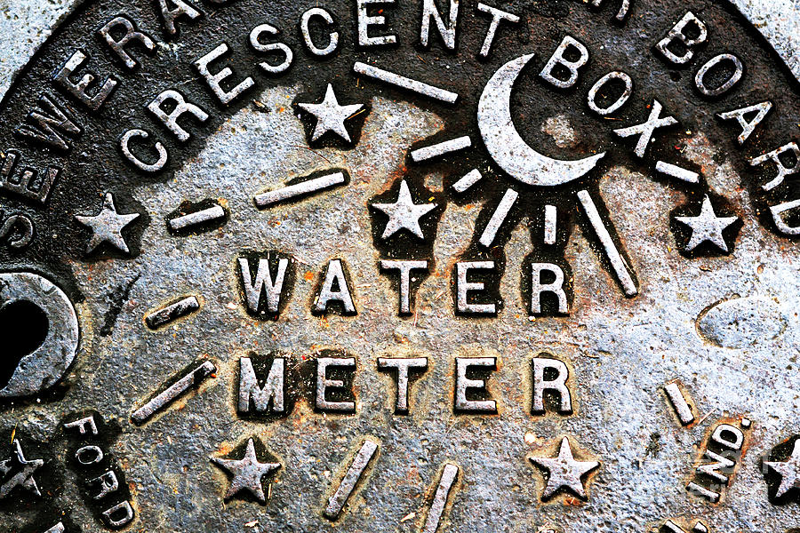 Retro New Orleans Water Meter Cover Photograph by John Rizzuto