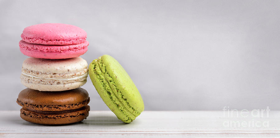 Retro pastel colorful macaroon cookies on vintage background Photograph by Jelena Jovanovic