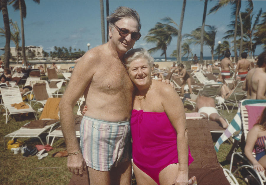 Retro Photograph of a Senior Couple in Swimwear, Standing by Sun Loungers Photograph by Digital Vision.
