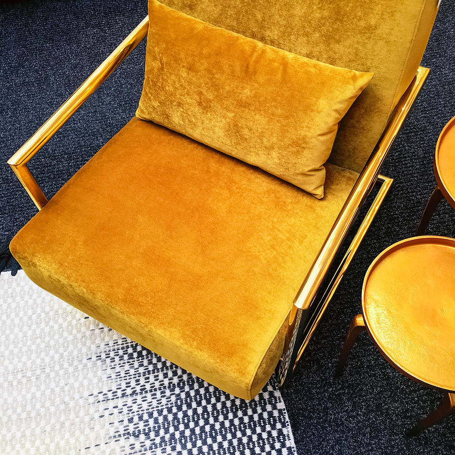 Retro style dark yellow velvet armchair and golden side table Photograph by Studio Light and Shade