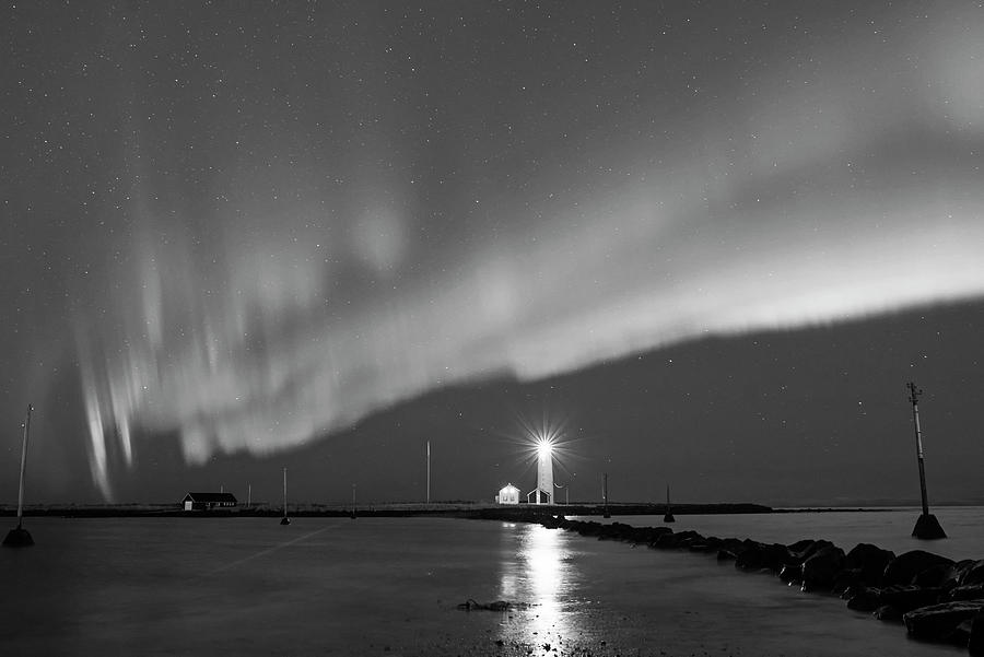 Reykjavik Iceland Beautiful Northern Lights at the Grotta Lighthouse Green Wave Black and White Photograph by Toby McGuire