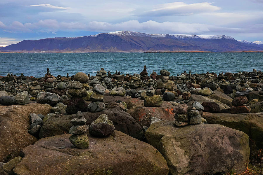 Reykjavik Rock Cairns and Waterfront Esjan Mountain Photograph by Toby McGuire