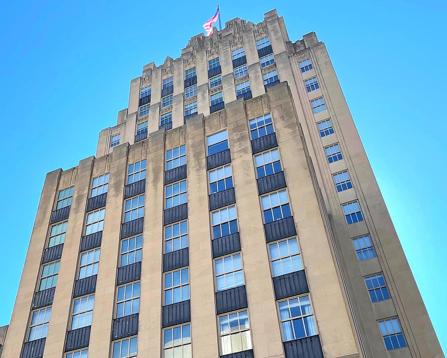 Reynolds Building with Flag Aglow Photograph by Lee Darnell