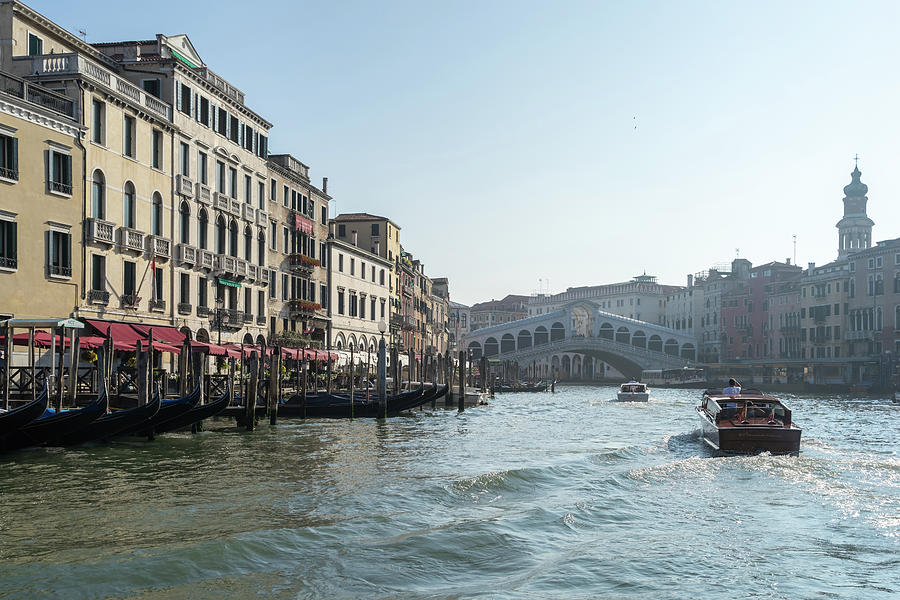 Rialto Bridge Traffic - Taxi Boats and Glossy Ripples on the Grand Canal in Venice  Photograph by Georgia Mizuleva