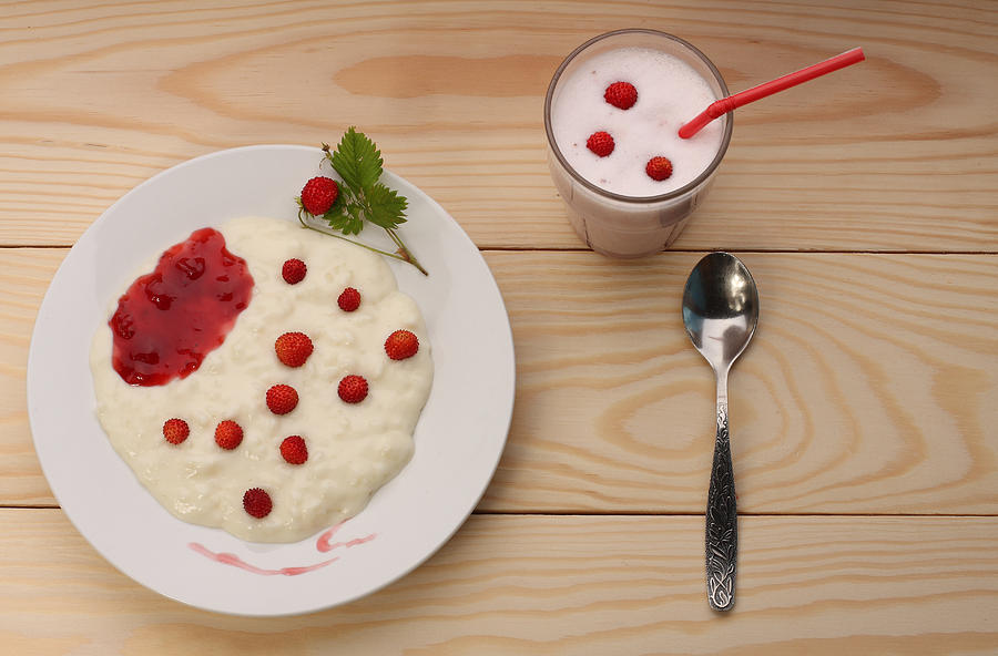 Rice milk porridge with wild strawberries and smoothie Photograph by PatrikSlezak