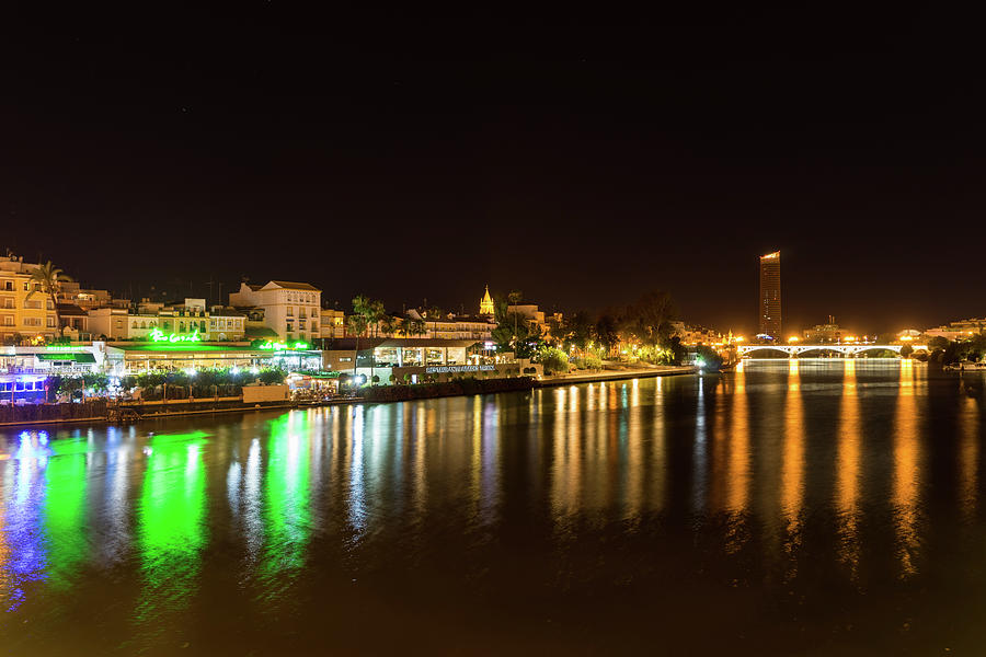 Rich Velvety Currents - Guadalquivir River Waterfront Bars And Restaurants And Triana Bridge Photograph