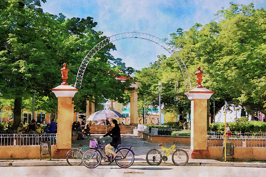 Riding a Bicycle in Trinidad Town Square Mixed Media by Peggy Collins
