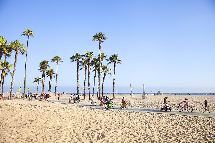 Riding bikes in Santa Monica Beach, California Photograph by Stellalevi