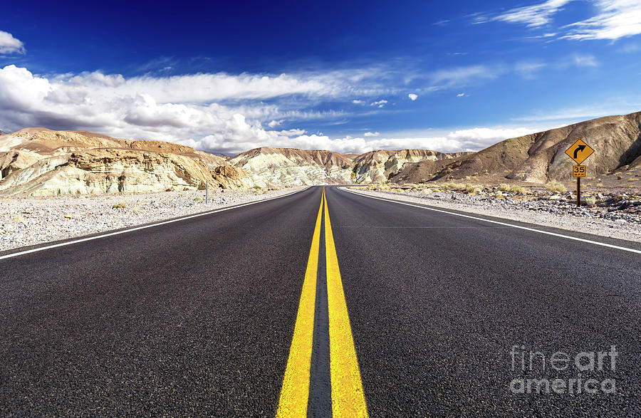 Riding Down the Highway at Death Valley California Photograph by John Rizzuto