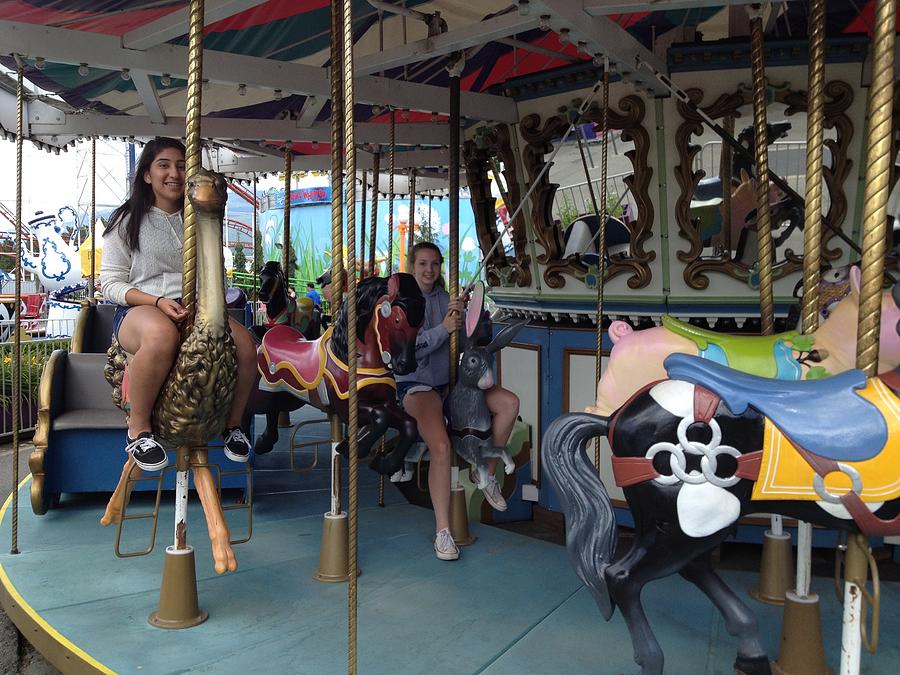 Riding the carousel Photograph by Lawrence Christopher - Fine Art America