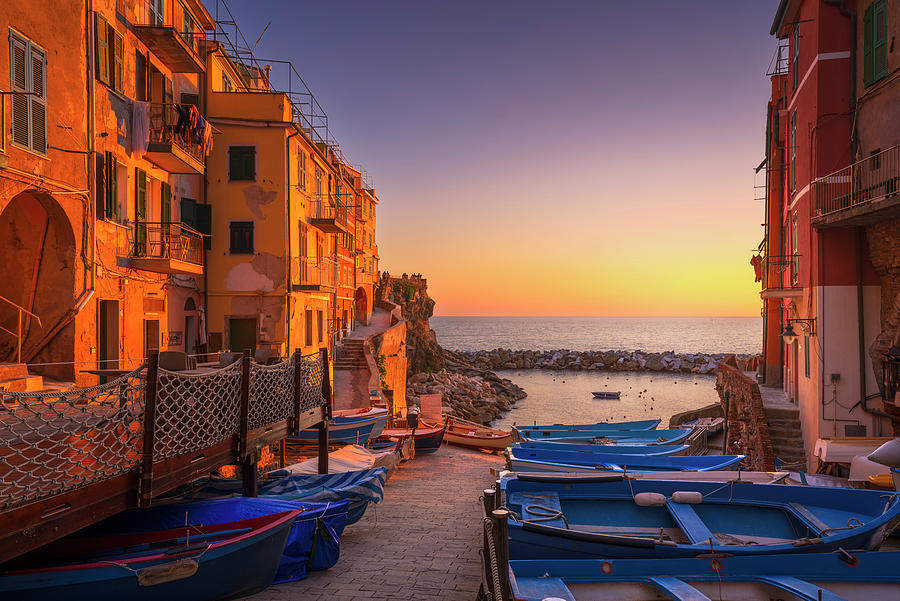 Riomaggiore boats in the street and sea at sunset. Cinque Terre Photograph by Stefano Orazzini