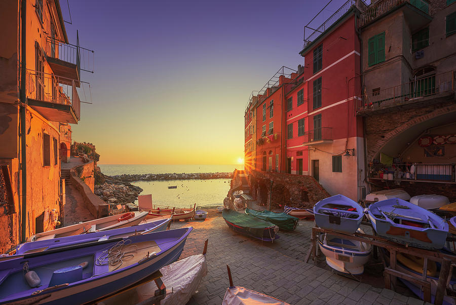 Riomaggiore, boats in the street at sunset. Cinque Terre Photograph by Stefano Orazzini