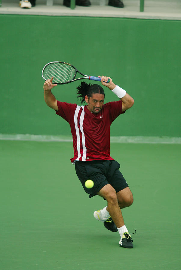 Rios hits a forehand Photograph by Donald Miralle