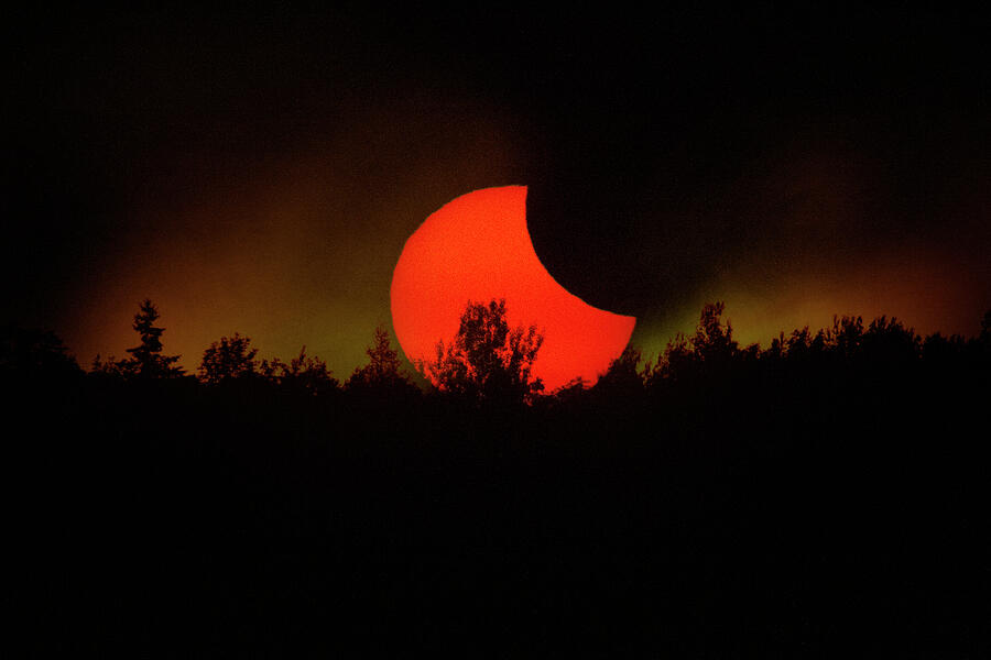 Rising Eclipsed Photograph by John Meader