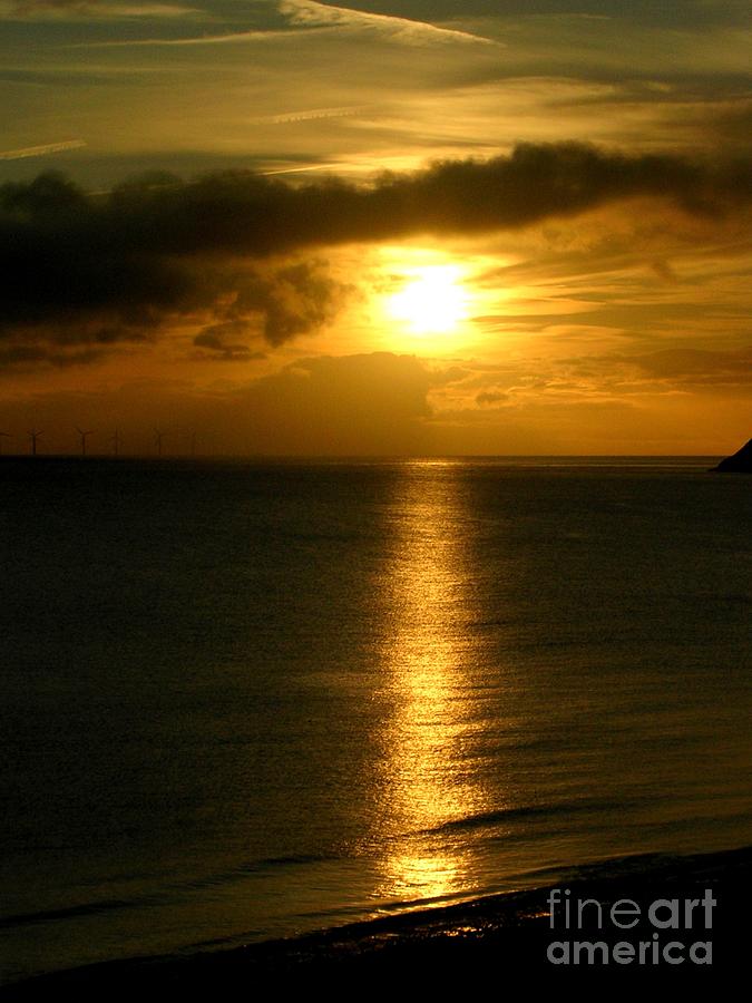 Rising Sun On Llandudno Bay Photograph by Lesley Evered