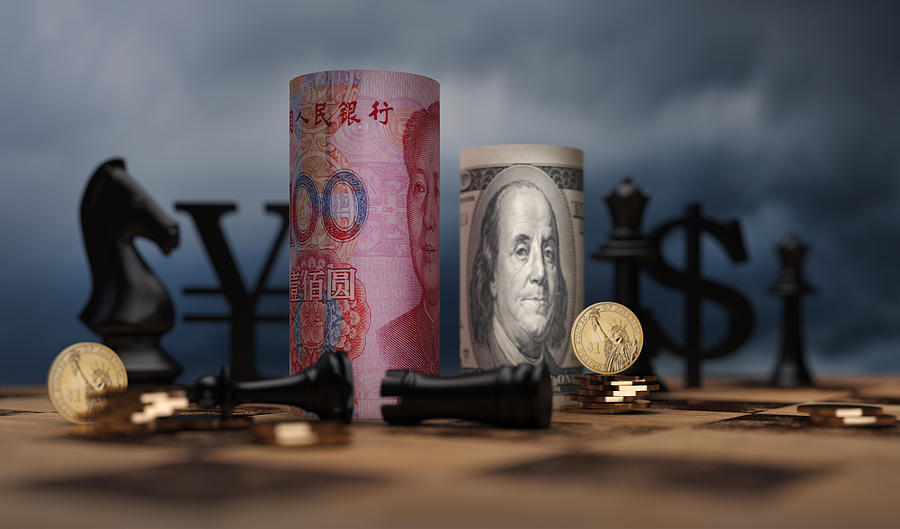 RMB and US dollar bank notes concept business background Photograph by Zhangshuang