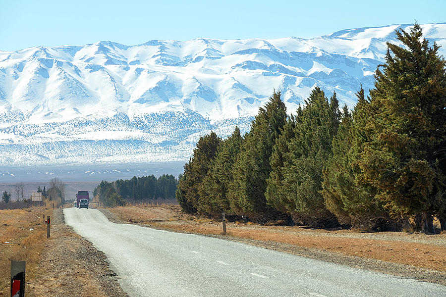 Road leading to snow Atlas mountains Photograph by Mikhail Kokhanchikov