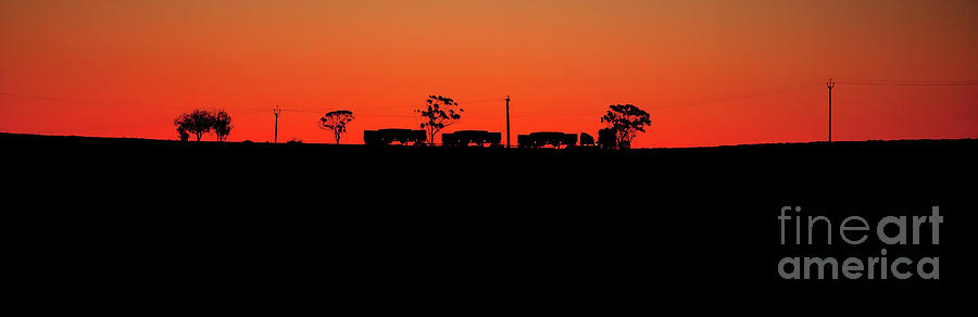 Road Train Sunset Silhouette Photograph by Bill Robinson