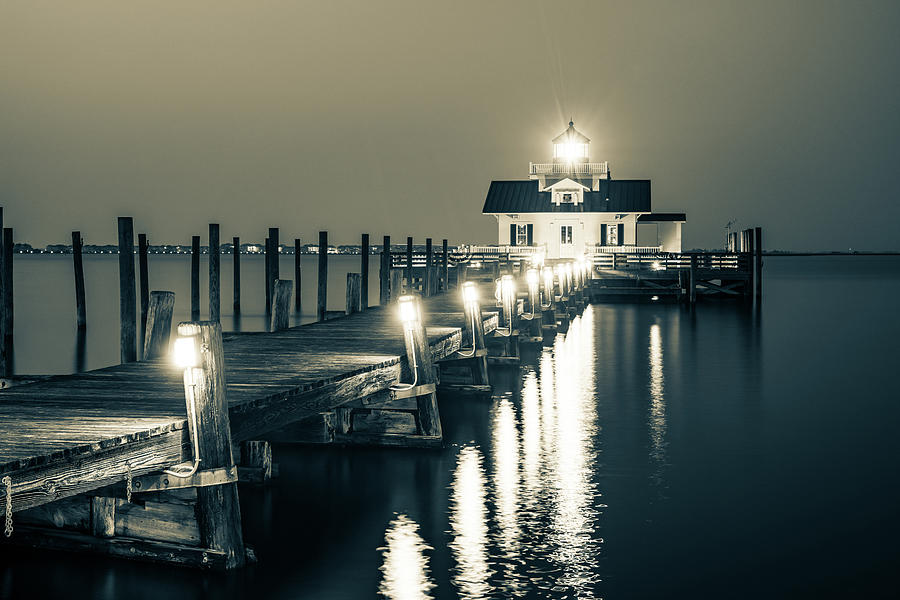Black And White Photograph - Roanoke Marshes Lighthouse Guiding Light - Sepia Edition by Gregory Ballos