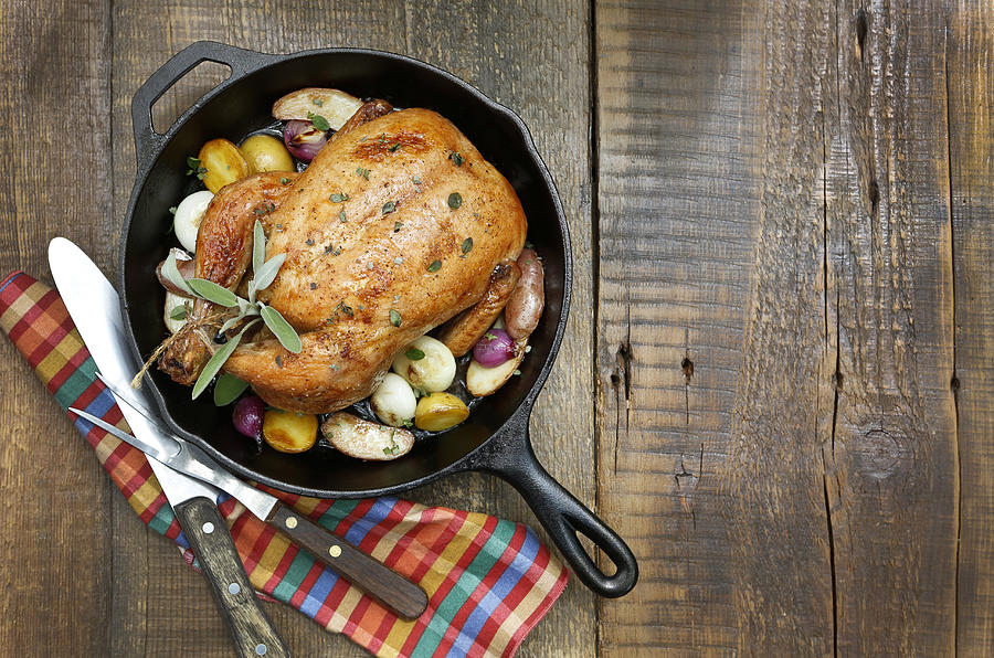 Roast Chicken with Potatoes and Onions in Cast Iron Pan. Photograph by JMichl