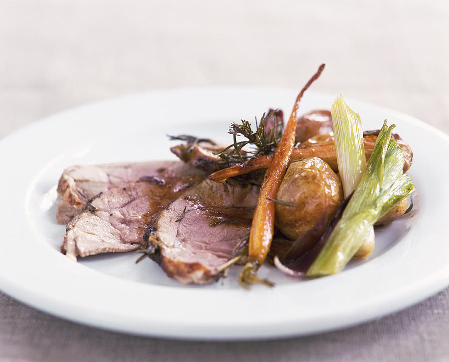 Roast Lamb and Vegetables on a Plate Photograph by Marie-Louise Avery