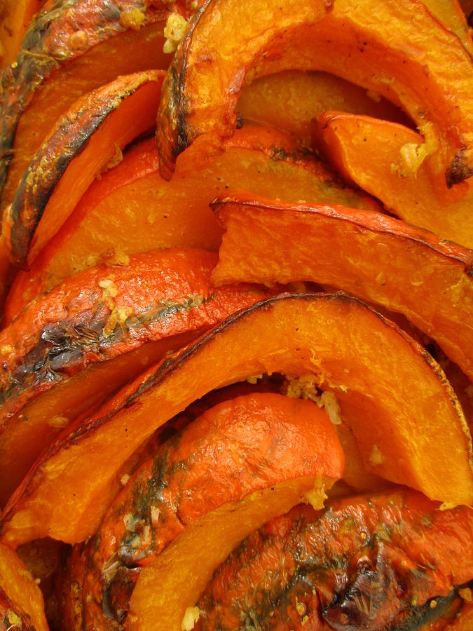 Roasted pumpkin slices, closeup Photograph by Tanai