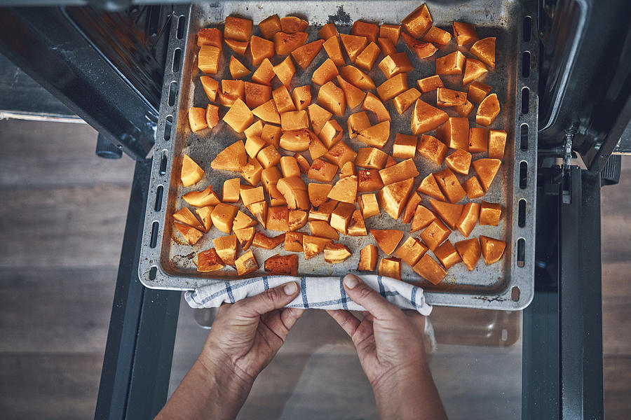 Roasting Pumpkins in the Oven Photograph by GMVozd