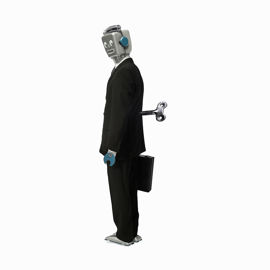 Robot businessman stands with a key in his back Photograph by Andrew Bret Wallis
