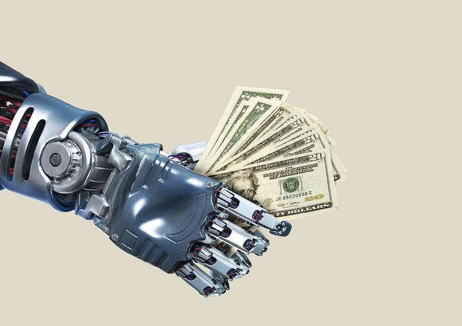 Robot hand holding lots of dollar notes Photograph by Paper Boat Creative