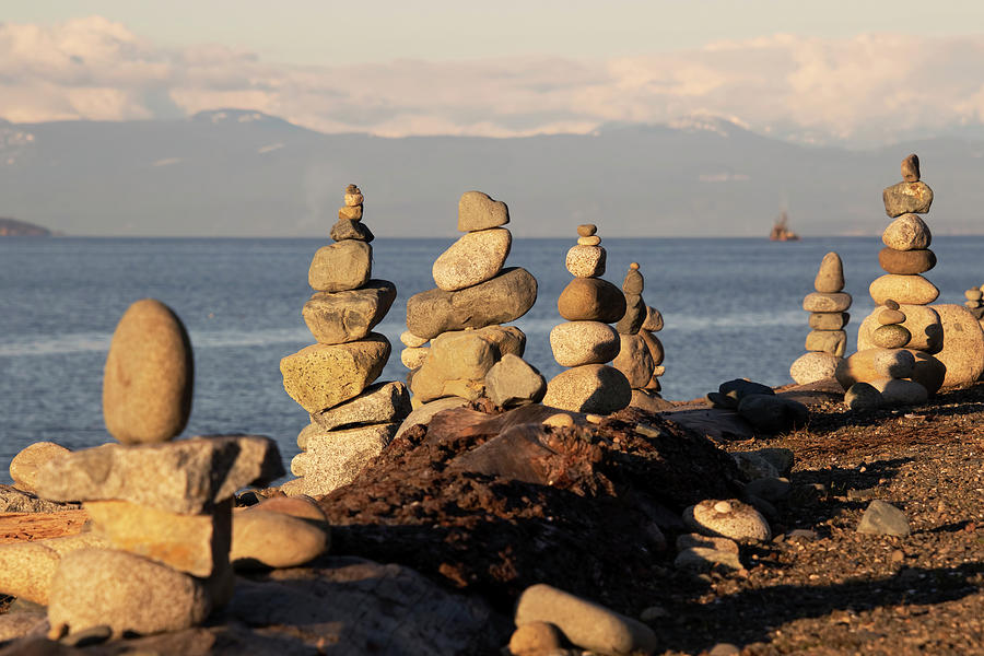 Rock Cairns Overlooking the Beach Photograph by Peggy Collins