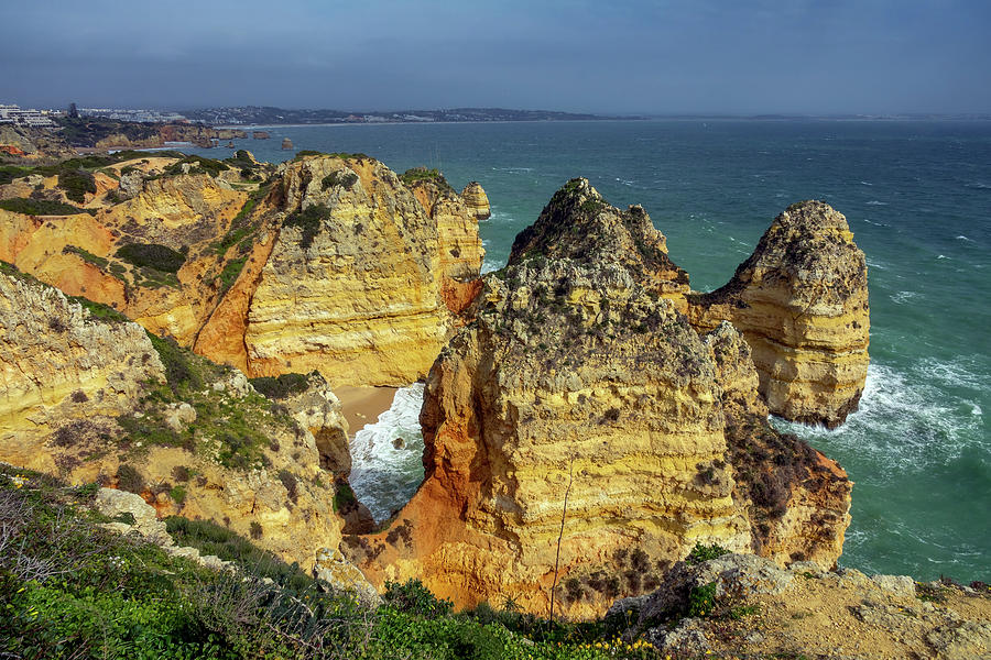 Rock cliffs and waves in Portugal Photograph by Mikhail Kokhanchikov