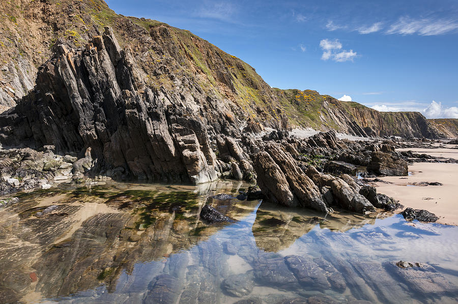 Rock pools at Marloes sands Photograph by Photos by R A Kearton