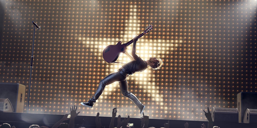 Rock Star In Mid Air Jump With Guitar On Stage Photograph by Peepo